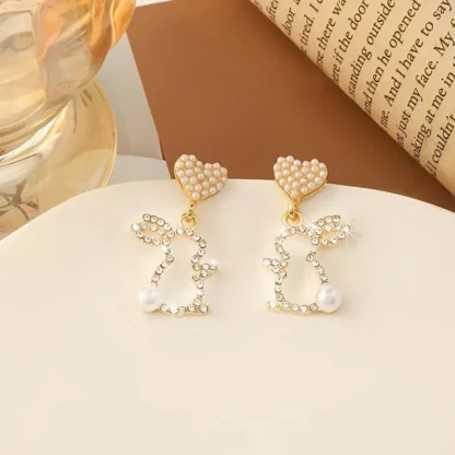 Rhinestone Bunny Earrings Dangling From a Heart