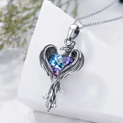 Silvery Phoenix Pendant With Purple Synthetic Gem Heart